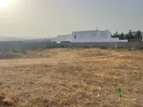A vendre à MONCHAR à 8 km de HAMMAMET un lot de terrain de 870 m2